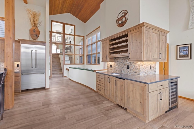 1107 Penstemon Rd, Dillon, CO 80435 - kitchen with open shelves, light brown cabinets, light wood-type flooring, stainless steel built in refrigerator, and high vaulted ceiling
