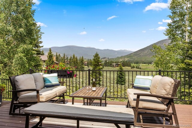 1107 Penstemon Rd, Dillon, CO 80435 - deck with outdoor lounge area and a mountain view
