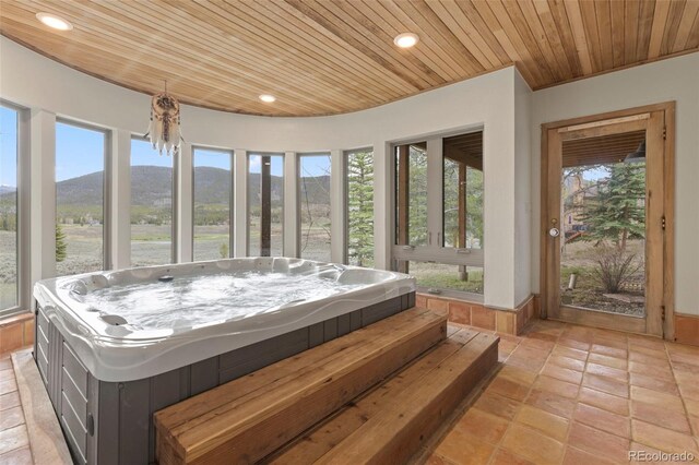 1107 Penstemon Rd, Dillon, CO 80435 - sunroom featuring a mountain view and a hot tub