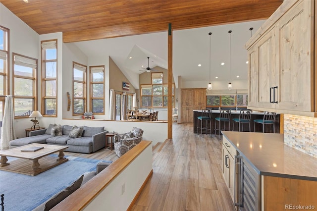 1107 Penstemon Rd, Dillon, CO 80435 - living room featuring high vaulted ceiling, light wood-style flooring, a ceiling fan, recessed lighting, and wood ceiling