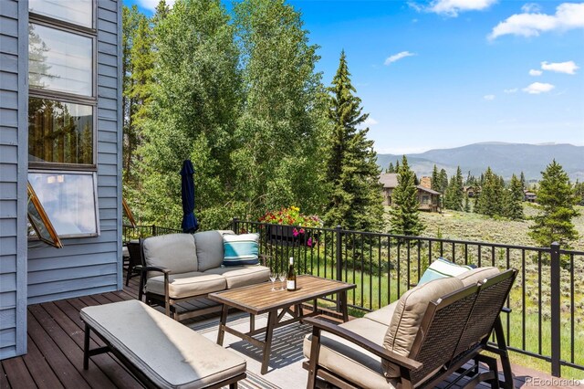 1107 Penstemon Rd, Dillon, CO 80435 - wooden deck with a mountain view and outdoor lounge area