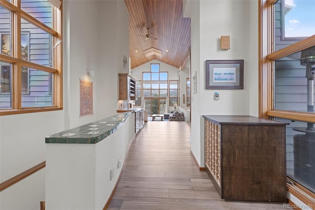 1107 Penstemon Rd, Dillon, CO 80435 - hall with baseboards, high vaulted ceiling, wood finished floors, and wood ceiling
