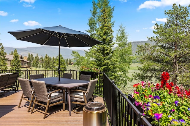 1107 Penstemon Rd, Dillon, CO 80435 - wooden deck with outdoor dining space and a mountain view