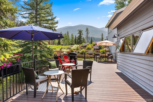 1107 Penstemon Rd, Dillon, CO 80435 - deck featuring outdoor dining space and a mountain view