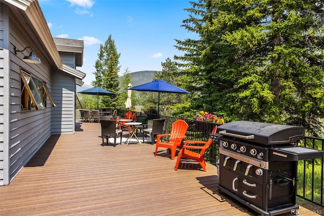1107 Penstemon Rd, Dillon, CO 80435 - wooden terrace featuring outdoor dining area and grilling area