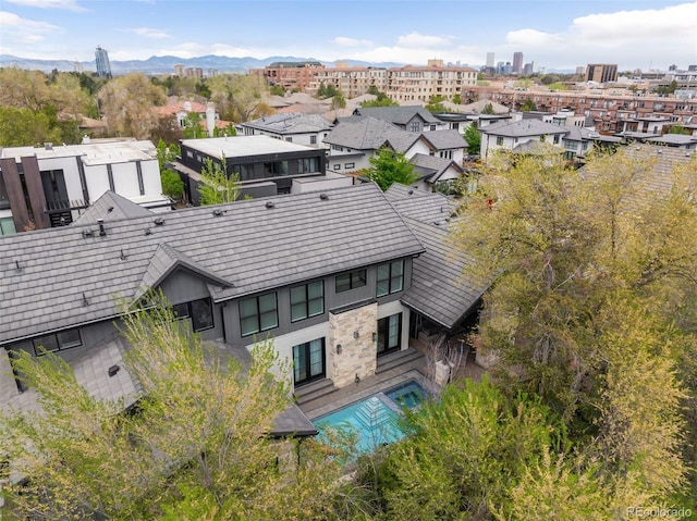 birds eye view of property with a residential view and a mountain view