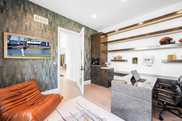 interior space featuring visible vents, light wood-style floors, baseboards, wallpapered walls, and recessed lighting