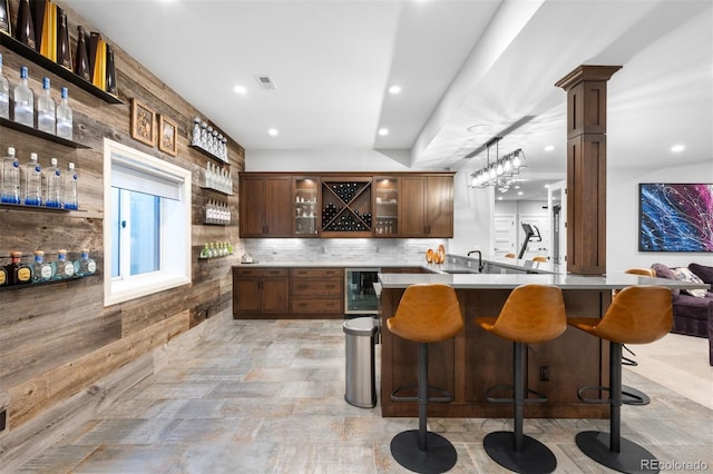bar featuring recessed lighting, decorative backsplash, visible vents, and beverage cooler