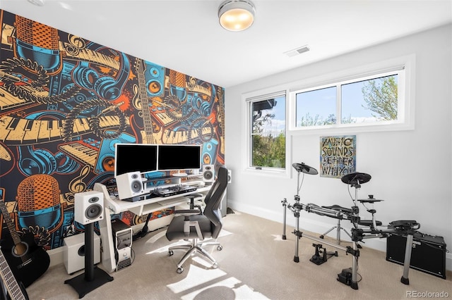 carpeted office space featuring baseboards and visible vents