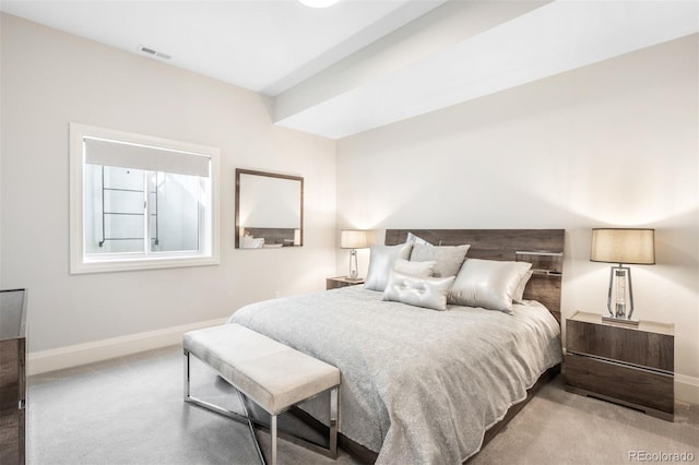 bedroom featuring visible vents, baseboards, and carpet floors