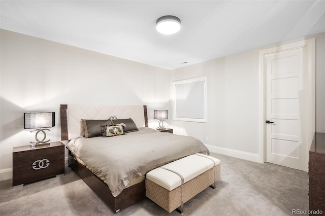 bedroom featuring baseboards and carpet flooring