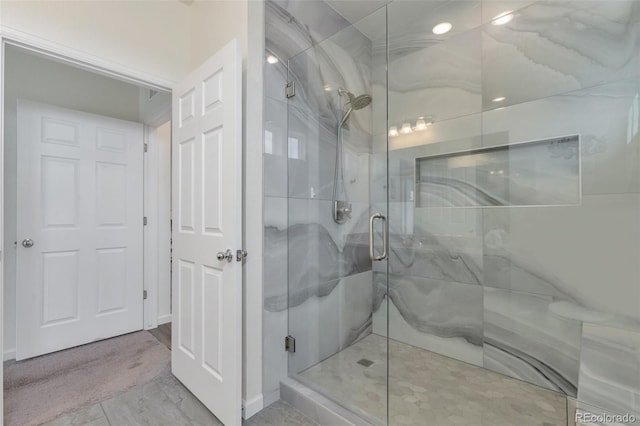 16841 Askins Loop Unit 101, Parker, CO 80134 - bathroom featuring a stall shower and recessed lighting