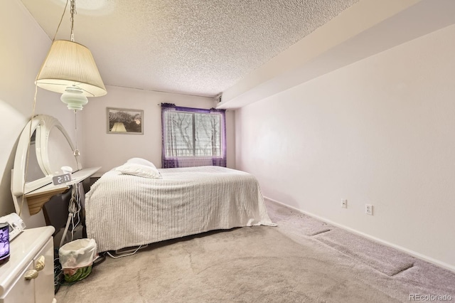 carpeted bedroom with a textured ceiling
