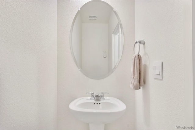 4125 Marble Dr, Longmont, CO 80504 - bathroom with a sink and a textured wall