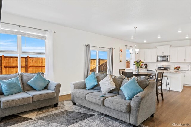 4125 Marble Dr, Longmont, CO 80504 - living area with wood finished floors and recessed lighting
