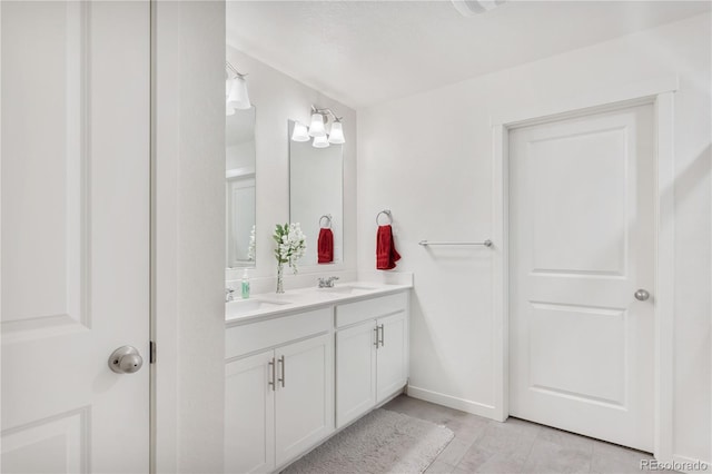 4125 Marble Dr, Longmont, CO 80504 - full bath with double vanity and baseboards