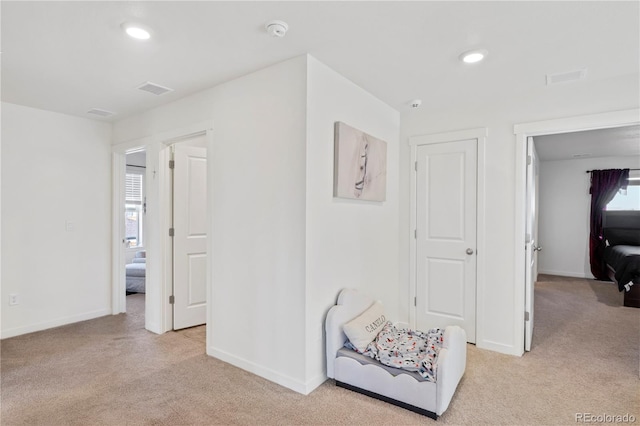 4125 Marble Dr, Longmont, CO 80504 - corridor featuring light colored carpet, baseboards, and recessed lighting