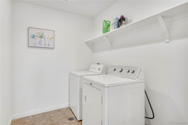 4125 Marble Dr, Longmont, CO 80504 - washroom featuring separate washer and dryer and baseboards