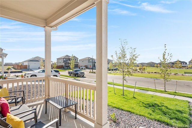4125 Marble Dr, Longmont, CO 80504 - view of patio with a residential view and covered porch