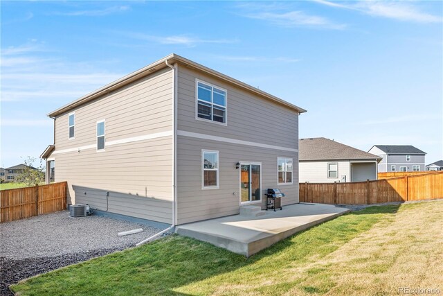 4125 Marble Dr, Longmont, CO 80504 - back of house with a patio and central air condition unit