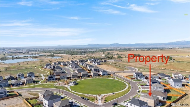 4125 Marble Dr, Longmont, CO 80504 - aerial view of residential area featuring a water and mountain view
