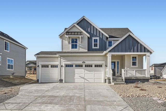 view of front of house featuring a garage and a porch