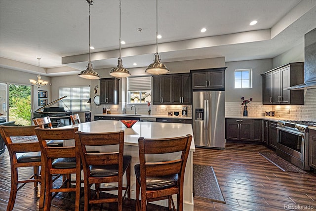 kitchen featuring appliances with stainless steel finishes, plenty of natural light, and decorative backsplash