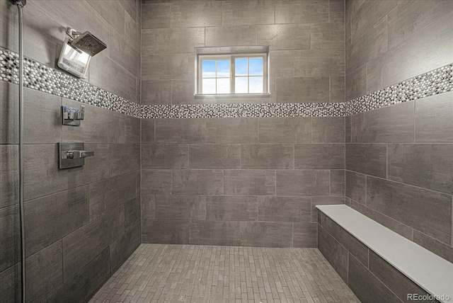 bathroom with tiled shower