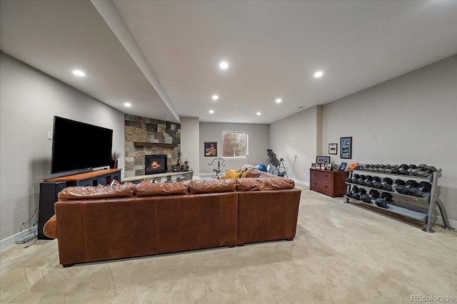 carpeted living room featuring a stone fireplace