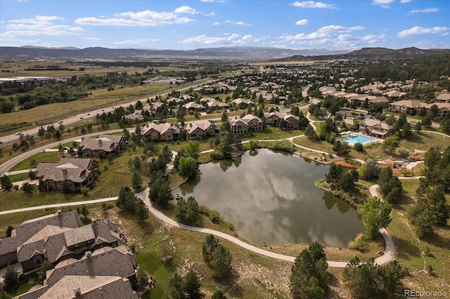 birds eye view of property with a residential view and a water and mountain view