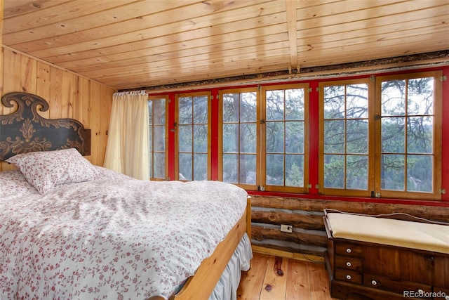 16048 Old Stagecoach Rd, Pine, CO 80470 - bedroom with wood ceiling and hardwood / wood-style flooring