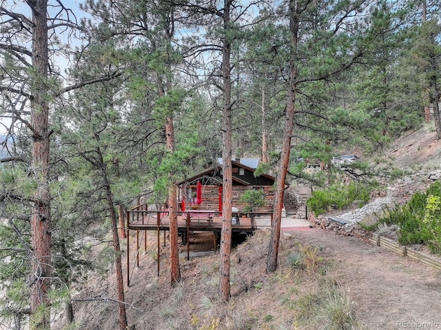 16048 Old Stagecoach Rd, Pine, CO 80470 - rear view of property featuring a deck, a forest view, and log exterior