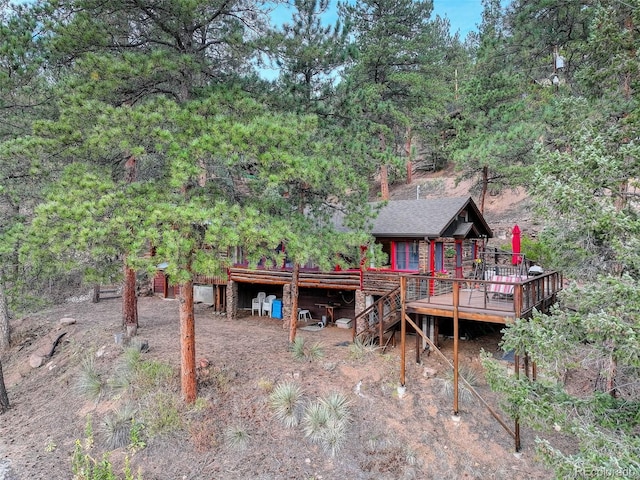 16048 Old Stagecoach Rd, Pine, CO 80470 - rear view of property featuring a wooden deck, roof with shingles, and stairway