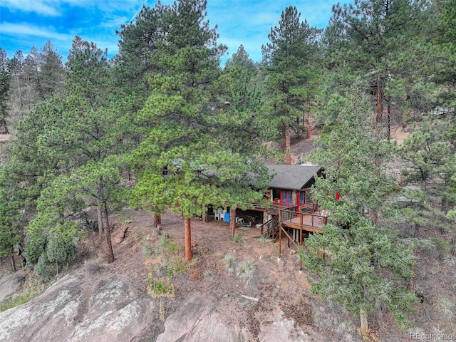 16048 Old Stagecoach Rd, Pine, CO 80470 - view of yard with a wooden deck and a forest view