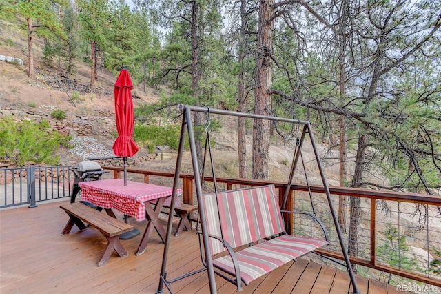 16048 Old Stagecoach Rd, Pine, CO 80470 - deck with outdoor dining area and a grill