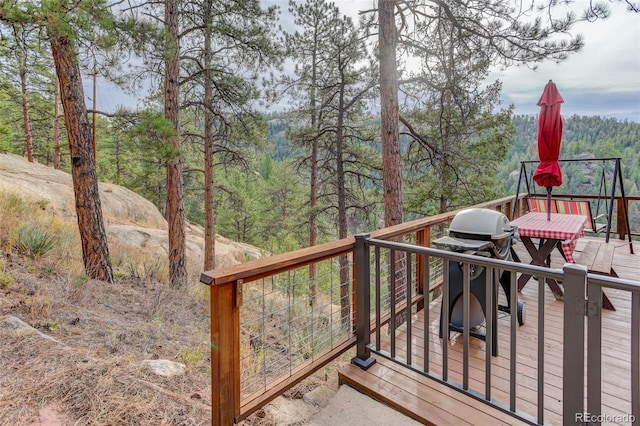 16048 Old Stagecoach Rd, Pine, CO 80470 - wooden deck with a wooded view