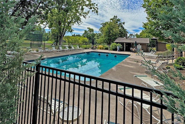 view of swimming pool with a patio area