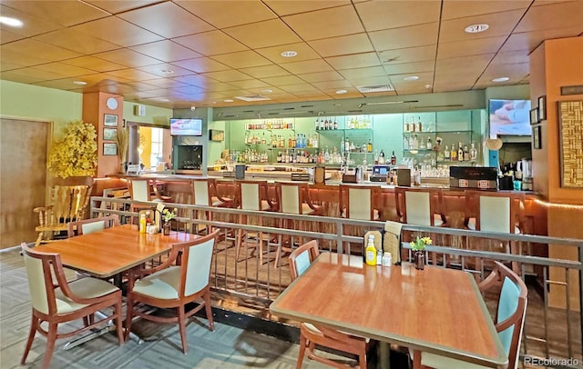 dining room with a paneled ceiling