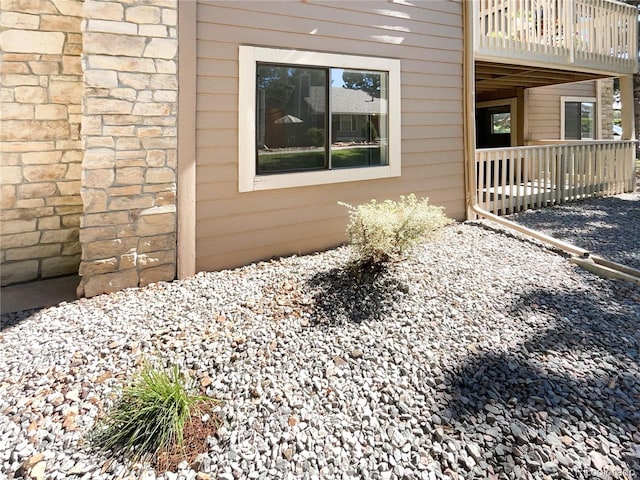 view of side of property with a deck