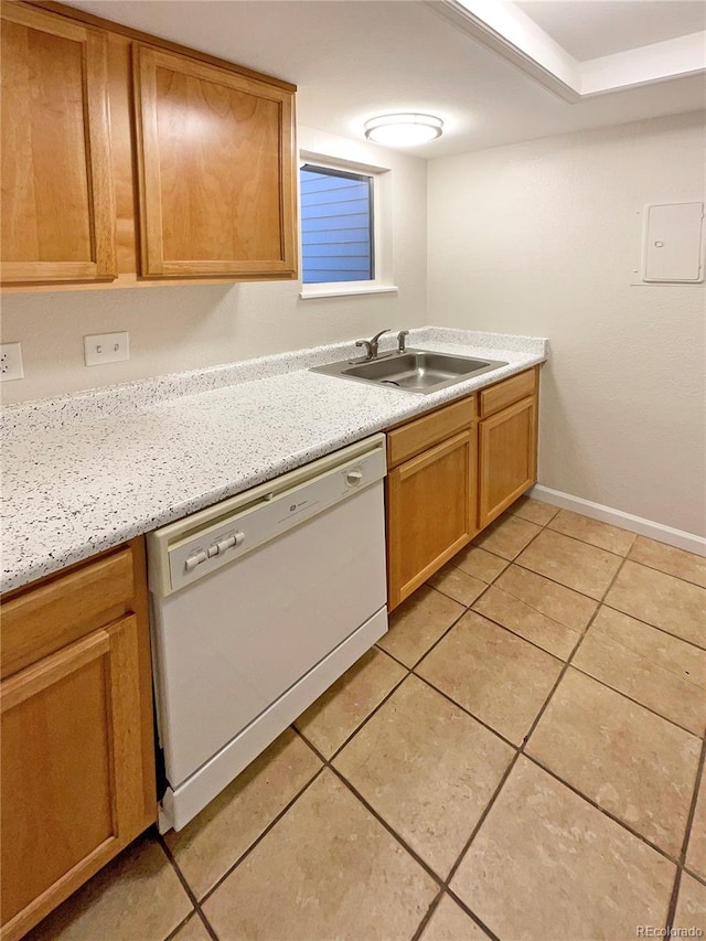 kitchen with light tile patterned floors, dishwasher, and sink