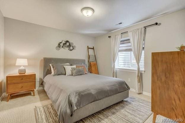 carpeted bedroom with baseboards