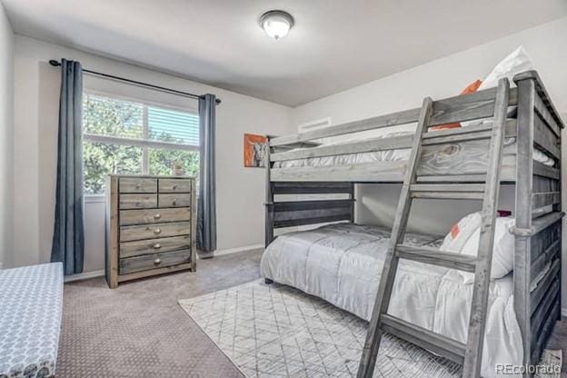 carpeted bedroom with baseboards