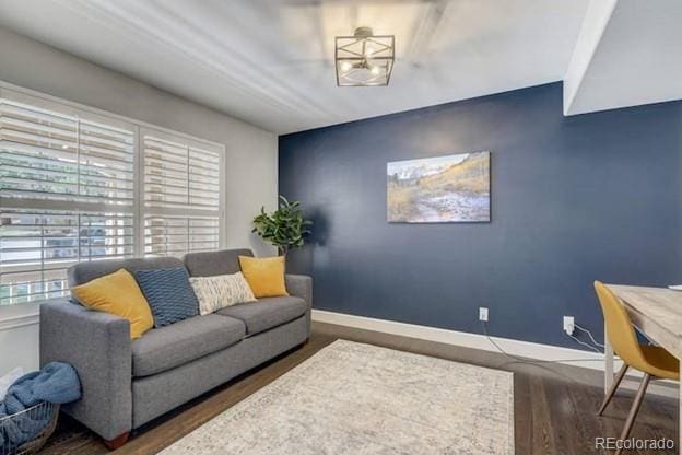 living room featuring baseboards and wood finished floors