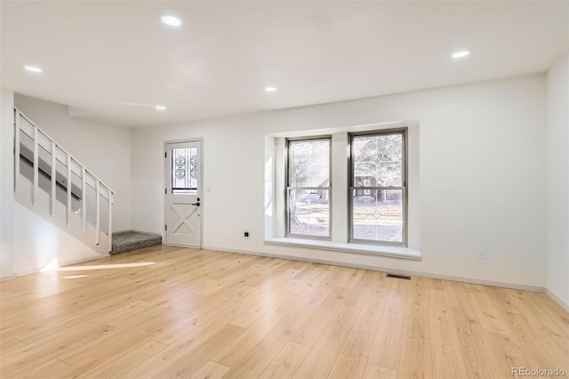 entryway with light hardwood / wood-style floors