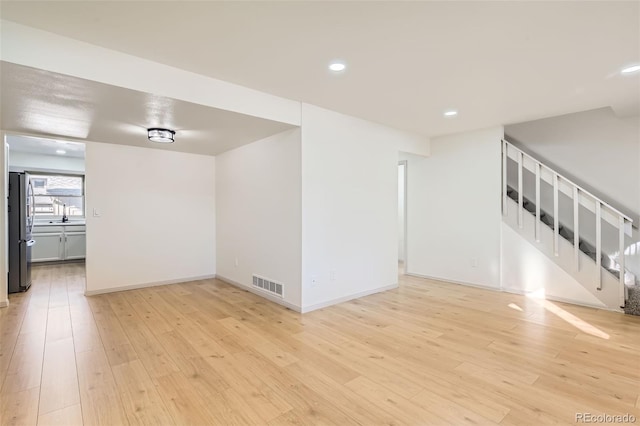 spare room with light wood-type flooring