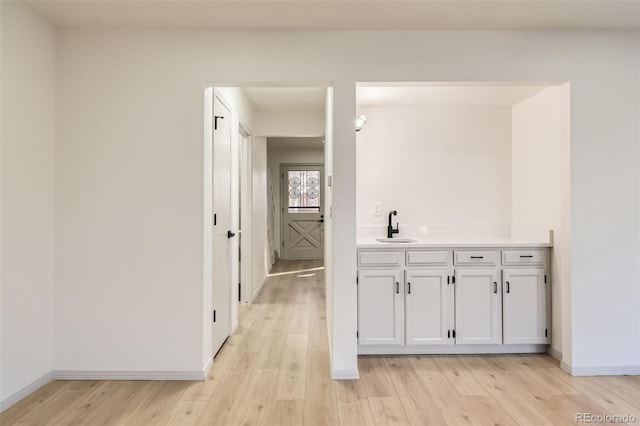 interior space with vanity and hardwood / wood-style flooring