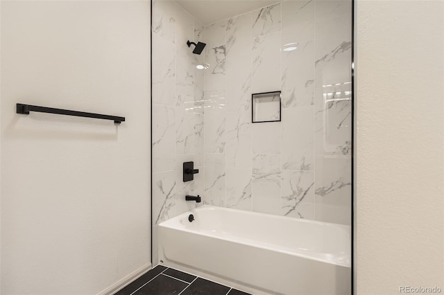 bathroom featuring tile patterned floors and tiled shower / bath