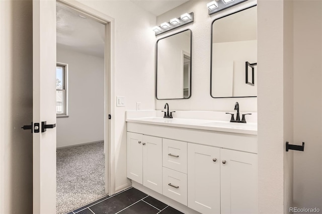 bathroom with tile patterned flooring and vanity