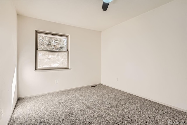 empty room with carpet flooring and ceiling fan