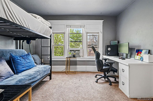 carpeted bedroom featuring baseboards and cooling unit